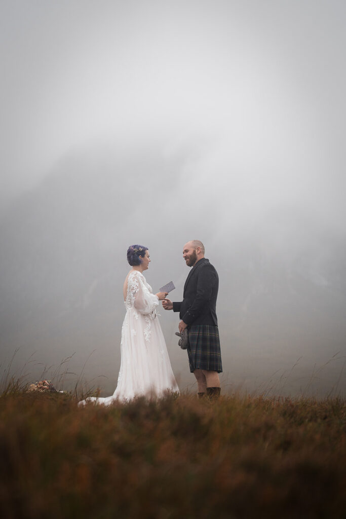 Couple eloping in scotland say vows beneath misty mountain